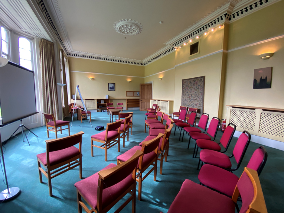 Drawing Room arranged for a presentation with chairs and a screen